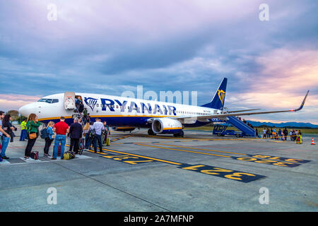 People boarding a Ryanair airplane on the tarmac at the Biarritz Airport, France Stock Photo