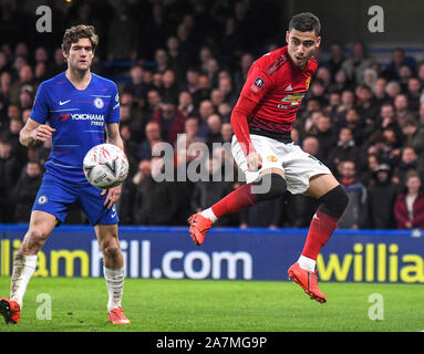 LONDON, ENGLAND - FEBRUARY 18, 2019: Marcos Alonso of Chelsea and Andreas Hugo Hoelgebaum Pereira of Manchester pictured during the 2018/19 FA Cup Fifth Round game between Chelsea FC and Manchester United at Stamford Bridge. Stock Photo