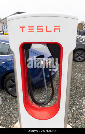 Tesla Cars charging at Darts Farm Superchargers, Exeter, Devon