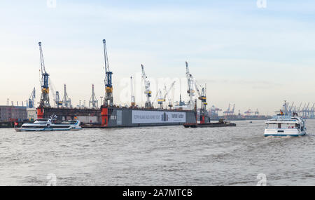 Hamburg, Germany - November 30, 2018: Floating dock 10 and ships are on the Elbe river in Hamburg port Stock Photo