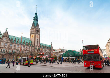 Hamburg, Germany - November 30, 2018: Tourists walk across Rathausmarkt near Hamburg City Hall. It is the central square of Hamburg, Germany, located Stock Photo
