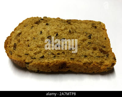 The photo shows slice toast, homemade bread with caraway isolated closeup in white background. Bread photos consisting of cut brown bakery products, r Stock Photo