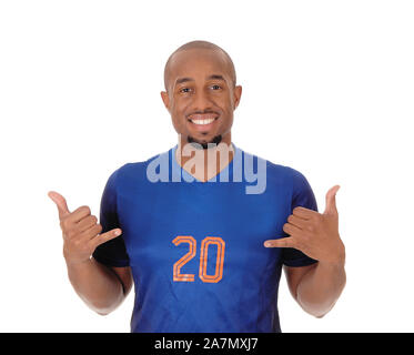 A young African American soccer player standing in the studio in his blue uniform pointing to himself, isolated for white background Stock Photo