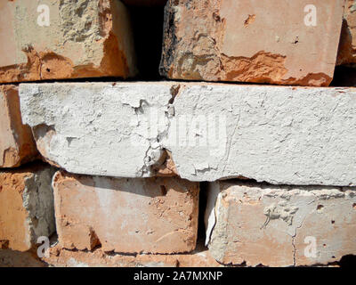 Texture brick, yellow color, background stone, structure lined with granite walls, sandstone on background bricks wall. Facing stones for decor house. Stock Photo