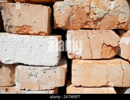 Texture brick, yellow color, background stone, structure lined with granite walls, sandstone on background bricks wall. Facing stones for decor house. Stock Photo