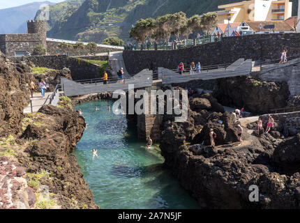 Porto Moniz, Madeira, Portugal - April 18, 2018: Natural rock pool of Porto Moniz on Madeira Island. Portugal.  It is a public bath with water from th Stock Photo