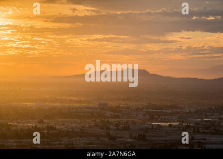 Los Angeles sunrise view across the San Fernando Valley towards Griffith Park in Southern California. Stock Photo