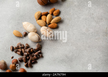 Organic nuts mix on gray background Stock Photo