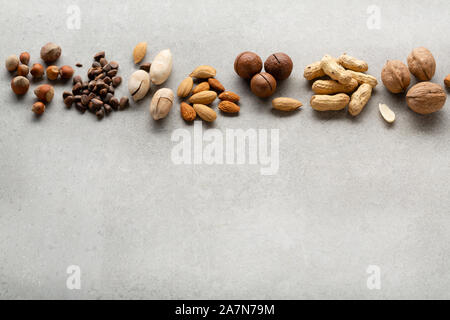 Organic nuts mix on gray background and copy space Stock Photo