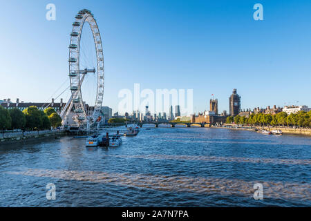 The London Eye and Houses of Parliament on the Thames Stock Photo