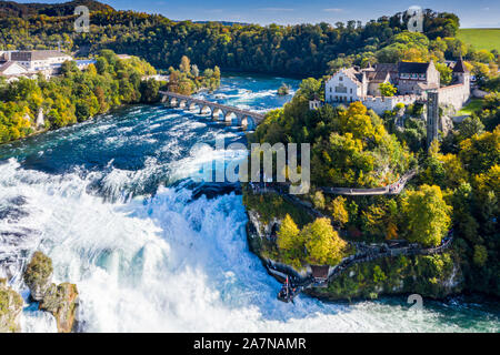 Rhine Falls or Rheinfall, Switzerland panoramic aerial view. Tourist boat in waterfall. Bridge and border between the cantons Schaffhausen and Zurich. Stock Photo