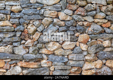 Detail of an old wall made of natural stone blocks Stock Photo