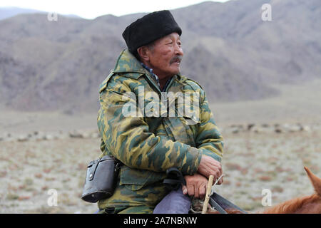 Sheepherder on horseback in Kyrgyzstan Stock Photo