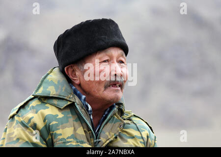 Sheepherder on horseback in Kyrgyzstan Stock Photo