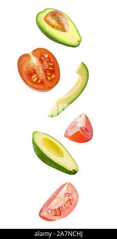 Vibrant falling vegetables isolated on white background Stock Photo