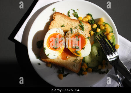 Soft Boiled Egg on Bread Toast. Healthy Breakfast Food. Morning Nutrition. Food Styling Table Setting. Stock Photo