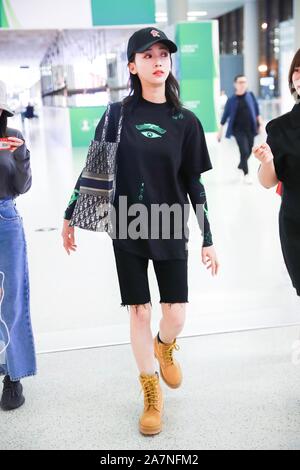 Chinese actress Wu Jiyan appears at an airport in Shanghai, China, 29 August 2019. Undershirt: Marine Serre Shorts: Rta Boots: Timberland Bag: Dior ** Stock Photo