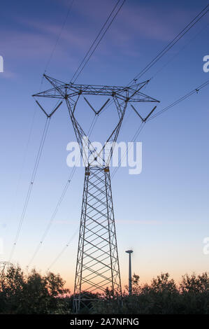 Electric lines near Brindisi, Italy, at sunset Stock Photo