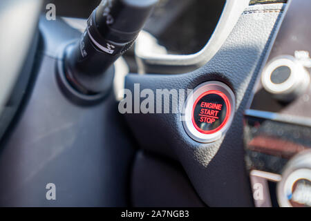 Engine start and stop push button car ignition in automobile console dashboard Stock Photo