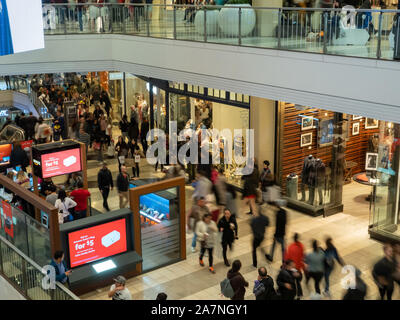 Customers walking through a shopping mall in the busy holiday season Stock Photo