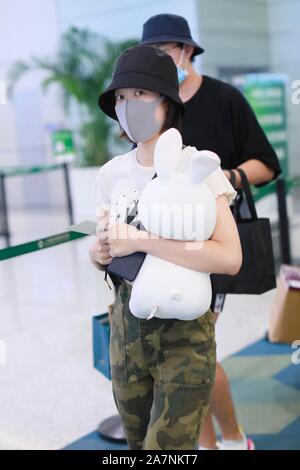 Chinese actress Zhang Xueying, also known as Sophie Zhang, arrives at the Shanghai Hongqiao International Airport before departure in Shanghai, China, Stock Photo