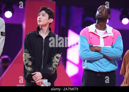 Dwyane Wade, right, and Bai Jingting, left, participate into the Chinese variety show, Dunk of China, in Beijing China, 20 August 2019. Dwyane Wade, a Stock Photo