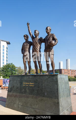 The United Trinity statue at entrance to Manchester United Old Trafford football ground, Trafford, Greater Manchester, England, United Kingdom