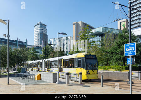 Manchester Metrolink train leaving MediaCityUK Station, Salford Quays, Salford, Greater Manchester, England, United Kingdom Stock Photo