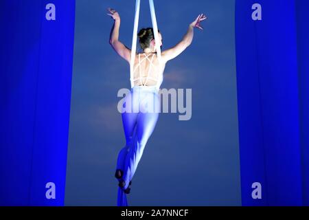 English highly experienced aerialist Amy Panter performs at the Golden Beech Beer City in Qingdao city, east China's Shandong province, 31 July 2019. Stock Photo