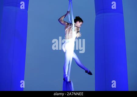 English highly experienced aerialist Amy Panter performs at the Golden Beech Beer City in Qingdao city, east China's Shandong province, 31 July 2019. Stock Photo