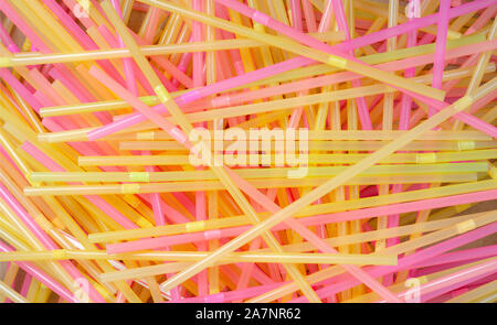 Closeup overhead  of   chaotic pile of multi colored cocktail straws. Stock Photo