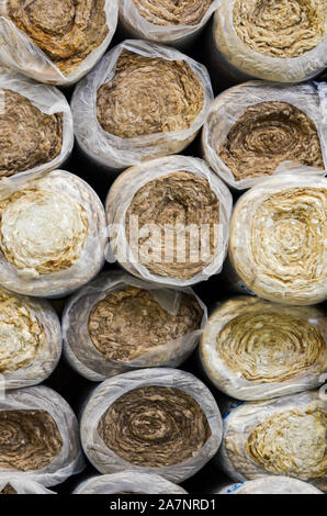 Close up  front view of  round basalt mineral wool packages  in plastic foil . Stock Photo