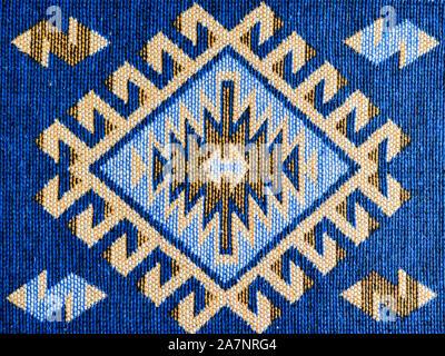 Romanian  hand-made blue carpets with ethnic ornaments. Stock Photo