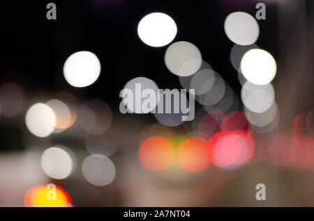 Blurred colorful   image of street  illuminated lights at night. Stock Photo