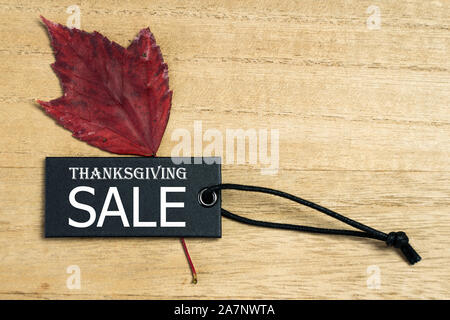 Black Friday sale label tag with autumn leaves Stock Photo