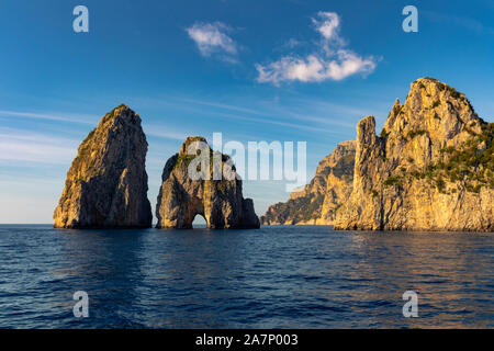 Magnificent rock formation Faraglioni di Mezzo at Capri island, Naples, Italy. Stock Photo