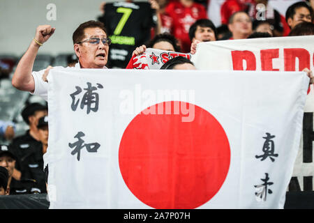 Fans cheer for the Urawa Red Diamonds team at the stand at the Shanghai SIPG F.C. VS Urawa Red Diamonds quarter final match during 2019 Asian Champion Stock Photo