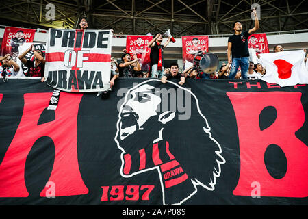 Fans cheer for the Urawa Red Diamonds team at the stand at the Shanghai SIPG F.C. VS Urawa Red Diamonds quarter final match during 2019 Asian Champion Stock Photo