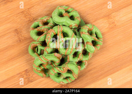 Brown and green caramel apple pretzel treats Stock Photo