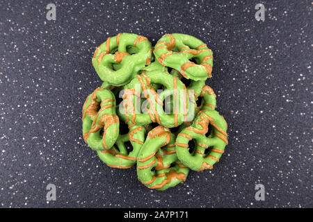 Brown and green caramel apple pretzel treats Stock Photo