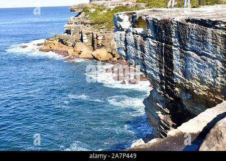 Waves crashing on rocks from cliff in Pacific Ocean, Australia Stock Photo