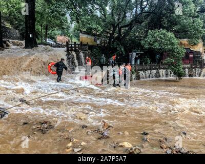 Chinese rescuers evacuate local residents in floodwater after heavy rainstorm caused by the Typhoon Lekima, the 9th typhoon of the year, in Ningbo cit Stock Photo