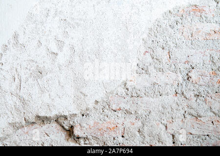 Grey coloured light tone rough grungy ruin textured old concrete wall background wallpaper Stock Photo