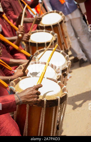 Close up of Group of People hands performing Indian art form Chenda or chande a cylindrical percussion playing during festival. Stock Photo