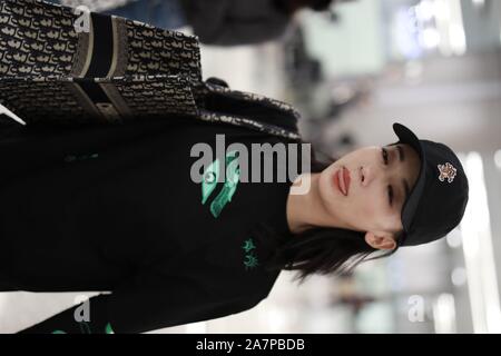 Chinese actress Wu Jiyan appears at an airport in Shanghai, China, 29 August 2019.   Undershirt: Marine Serre  Shorts: Rta  Boots: Timberland  Bag: Di Stock Photo