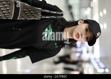 Chinese actress Wu Jiyan appears at an airport in Shanghai, China, 29 August 2019.   Undershirt: Marine Serre  Shorts: Rta  Boots: Timberland  Bag: Di Stock Photo