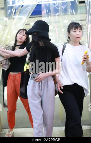 Chinese actress Yang Mi arrives at the Beijing Capital International Airport after landing in Beijing, China, 28 August 2019.   Handbag: Chanel Stock Photo