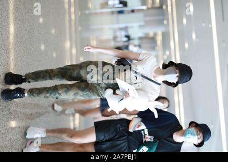 Chinese actress Zhang Xueying, also known as Sophie Zhang, arrives at the Shanghai Hongqiao International Airport before departure in Shanghai, China, Stock Photo