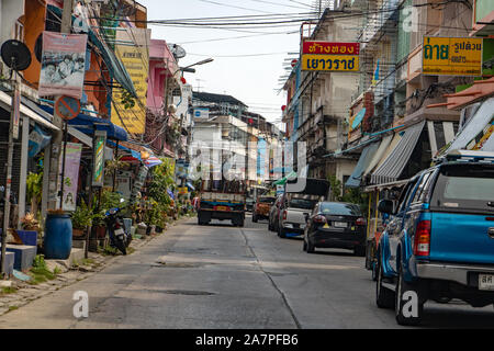 SAMUT PRAKAN, THAILAND, APR 27 2019,Street with traffic and parking cars in Samut Prakan city. Stock Photo