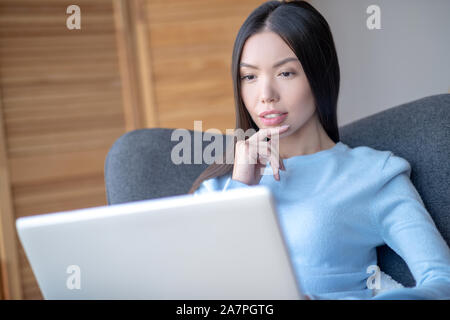 Freelancer feeling thoughtful while having complicated task Stock Photo